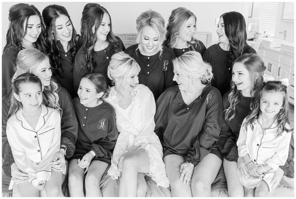 Bird's eye view of a reception table with gold accents, silverware, and flowers